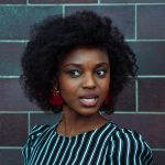 woman wearing black and green top